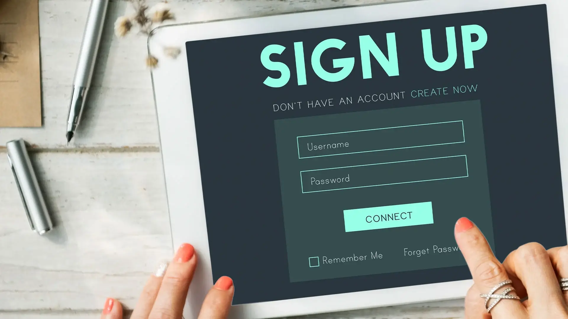 A person's hand is touching a digital tablet screen with a sign-up form displayed, including fields for username and password and a button that says "Connect".