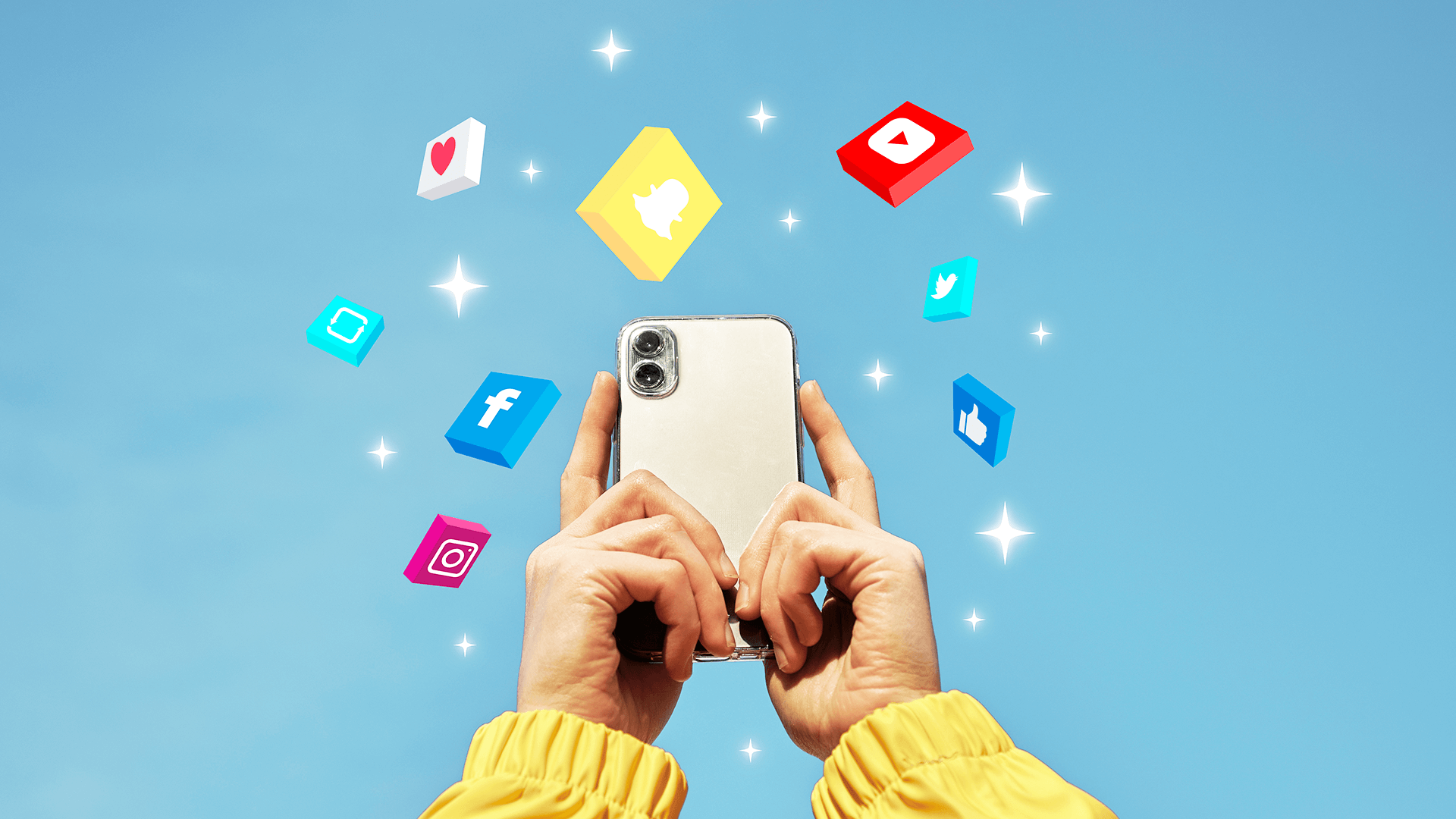 hands holding a phone with social media icons around it including youtube logo, snapchat logo, facebook logo, instagram logo,twitter logo, like icon, and love icon